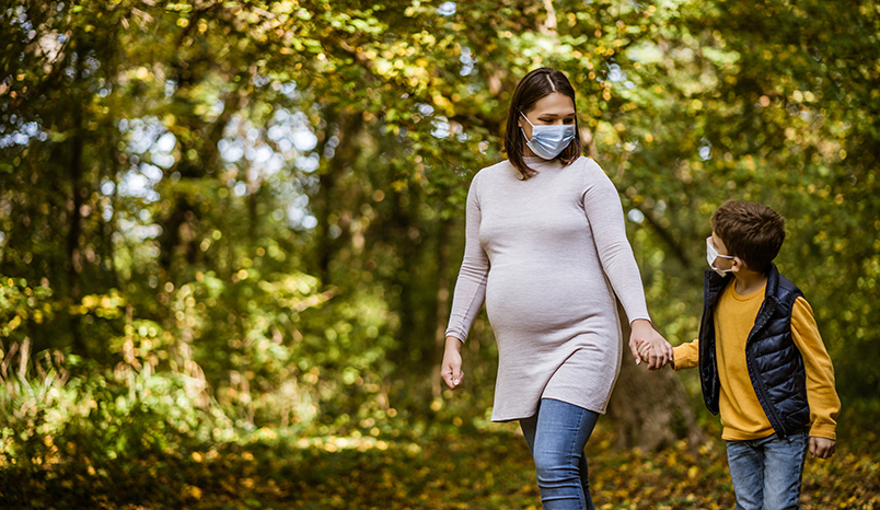 pregnant-woman-walking-with-son