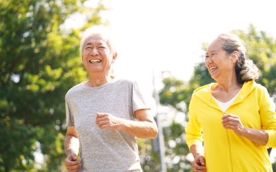 Seniors jogging outside.