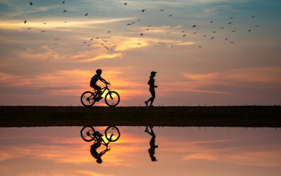 Biker and runner outside.