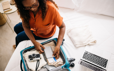 Retired woman packs suitcase.