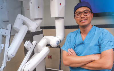 Dr. Pham with robotic equipment.