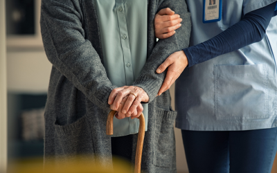 Older person and nurse at home.