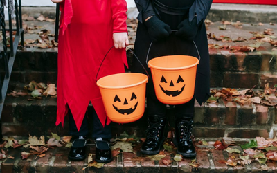 Kids with candy buckets.