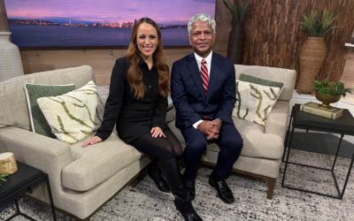 Seen on King 5 New Day NW: Overlake’s Sports & Spine doctor sitting on couch with Kelly the host