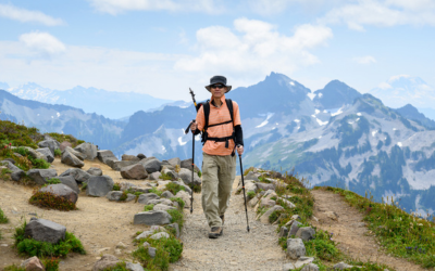 Front view of a man hiking at Skyline Loop Trail. Mt Rainier National Park. Washington State.
