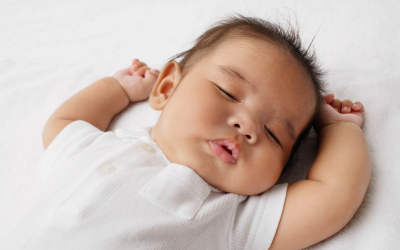 Baby sleeps soundly on back.