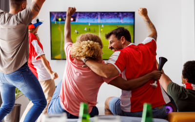 Soccer fans celebrate during match