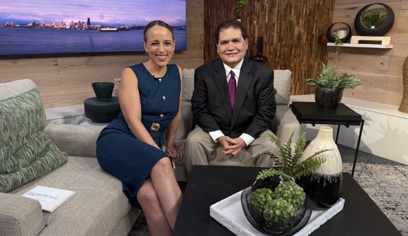 Seen on King 5 New Day NW: Overlake's Heart & Vascular Center surgeon sitting in chair next to Kelly the host