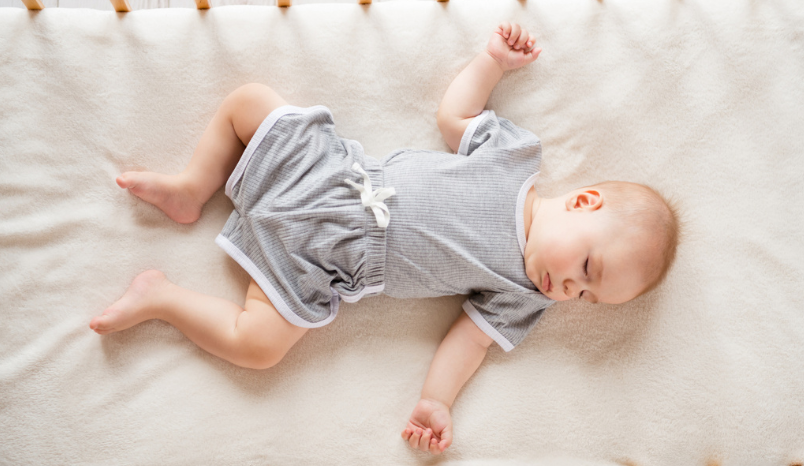 Above view of toddler closed eyes sleeping