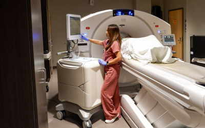 Nurse uses CT equipment