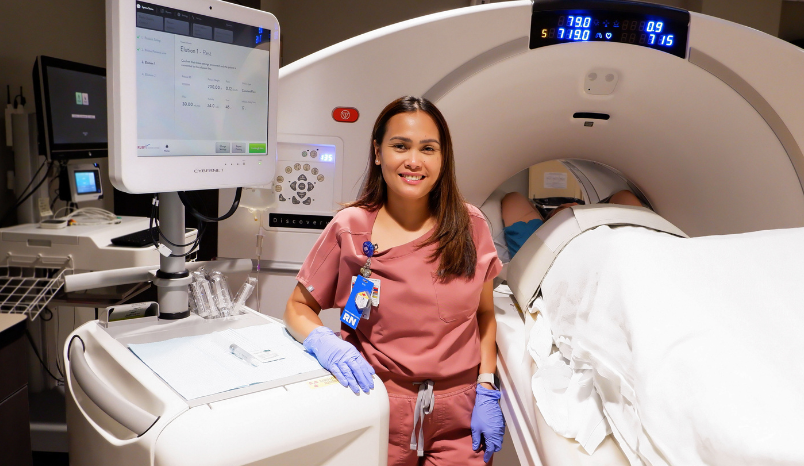 Nurse with new CT equipment