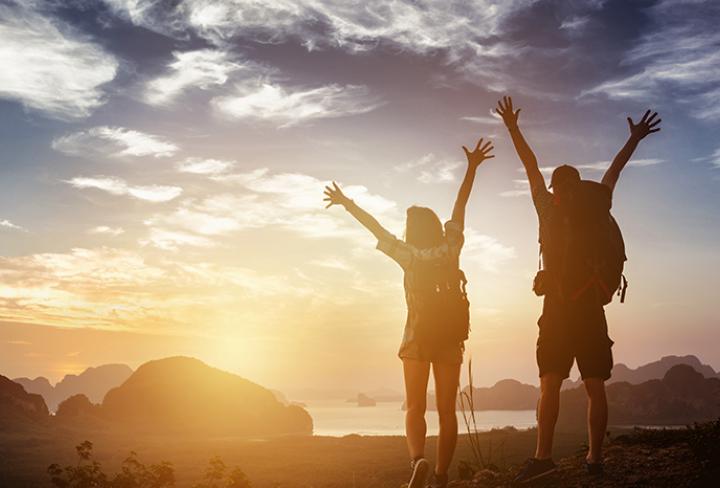 Two hikers celebrating a successful hike