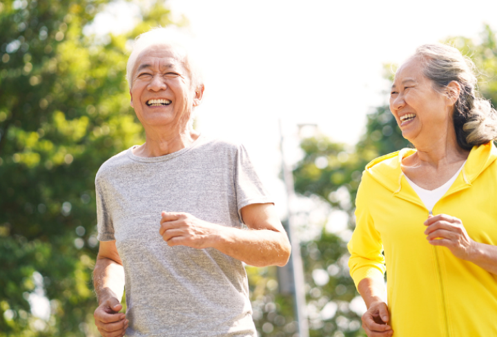 Seniors jogging outside.