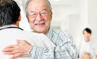 A patient showing gratitude by hugging doctor 