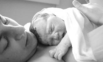 Parent holding newborn