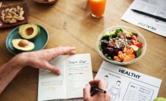 Person planning out healthier meal choices