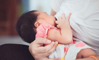 Mother breastfeeding baby
