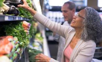 People grocery shopping for fresh produce