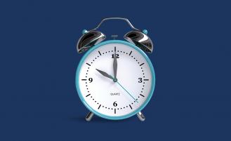 analog-alarm-clock-against-blue-background