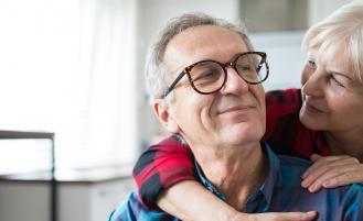 woman-with-arms-around-man's-shoulders