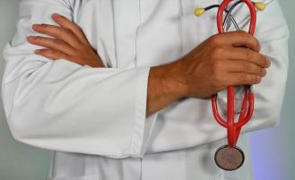 doctor holding stethoscope