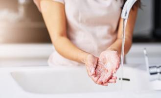woman-washing-hands-sink