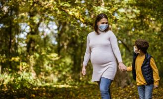 pregnant-woman-walking-with-son