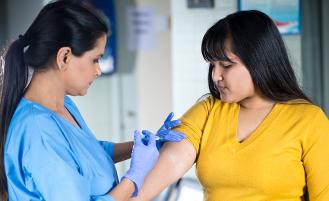 young-woman-receiving-shot-from-nurse