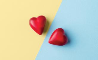 two-red-hearts-on-blue-yellow-background