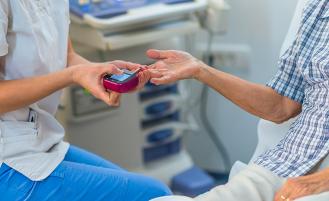 nurse-checking-patient-blood-sugar