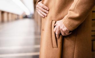 man-wearing-camel-colored-coat-with-hand-in-pocket
