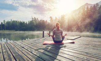 woman-on-dock-doing-yoga