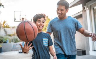 child-and-dad-playing-basketball