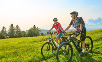 Two older women biking in Washington.