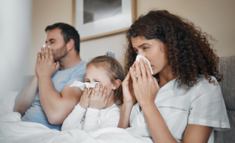 Family of three at home sick.
