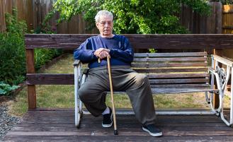 Elder man sitting on bench