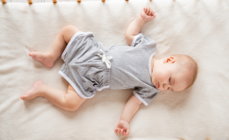  Above view of toddler closed eyes sleeping