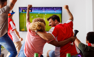 Fans celebrate during soccer match.