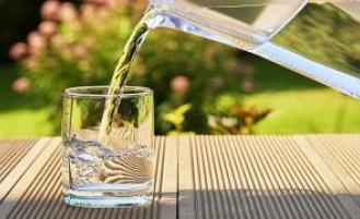 Glass of water being poured