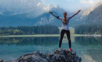 Runner enjoying a rest near a lake