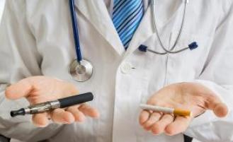 A doctor holding a vape pen in one hand and a cigarette in the other