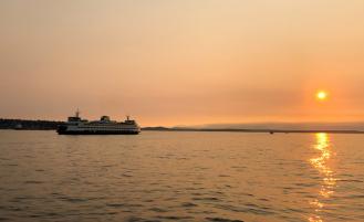 Large ship out on the water during a smoky day