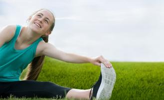 Teen runner stretching 