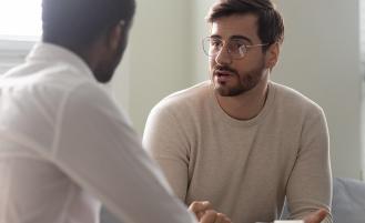 man-speaking-with-healthcare-professional