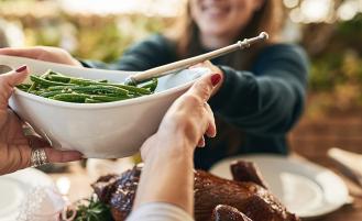 green-beans-bowl-passing-across-table