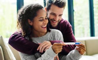 couple-holding-pregnancy-test