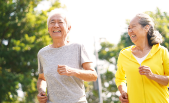 Seniors jogging outside.