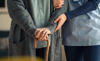 Older person at home with nurse.